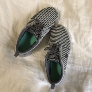 Grey Nike running shoes